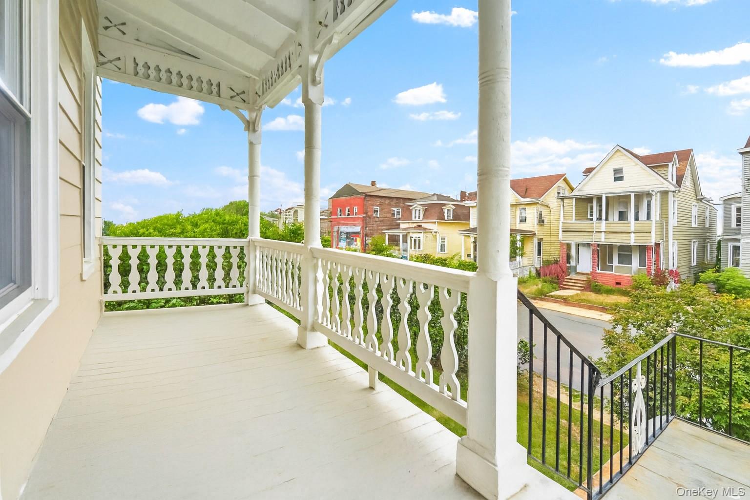 139 Spring Street Ossining, NY 10562 - Photo 2 of 29 Porch featuring a residential view and a sunroom