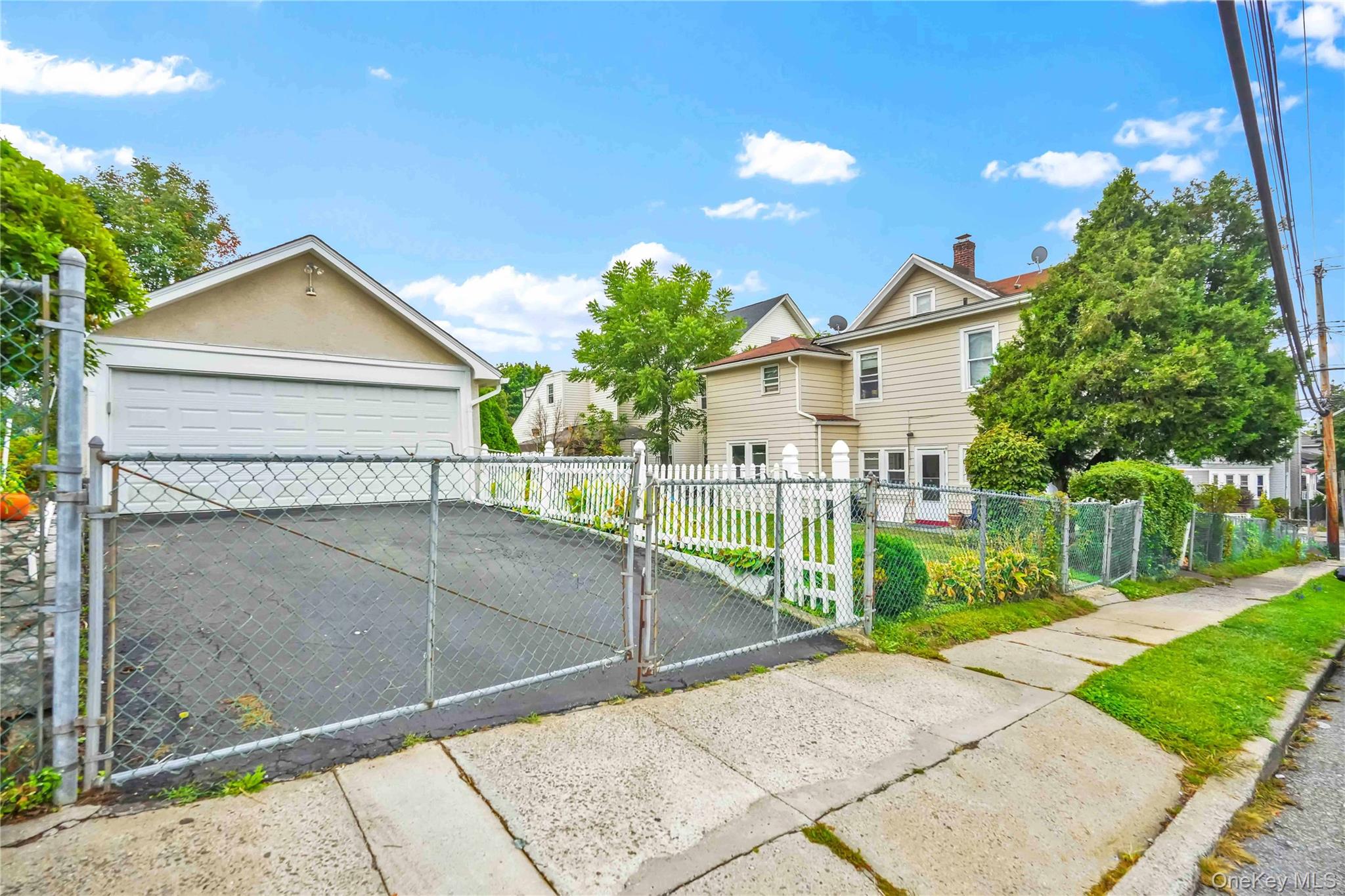 139 Spring Street Ossining, NY 10562 - Photo 24 of 29 Gate featuring a fenced front yard and a residential view
