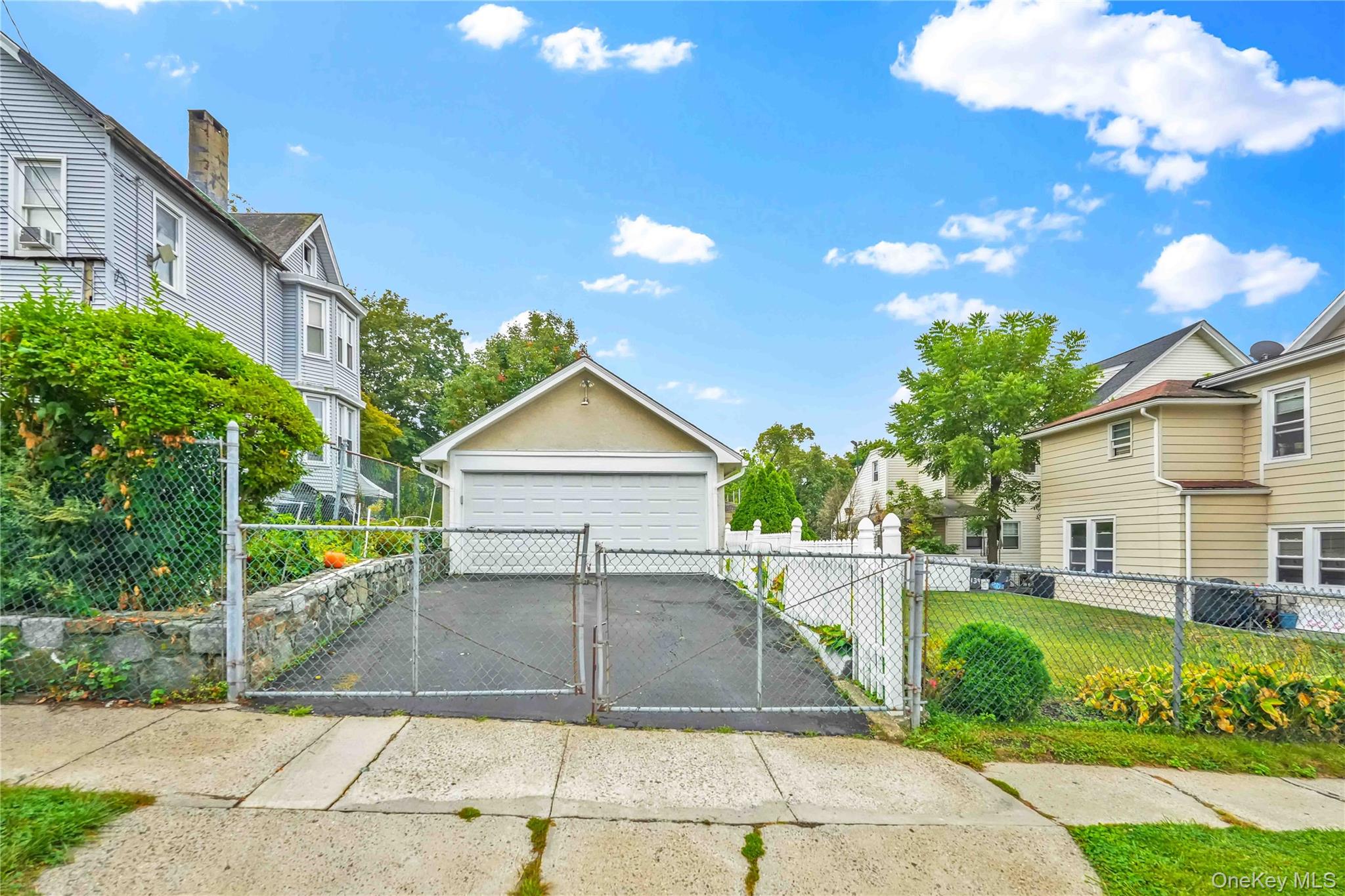 139 Spring Street Ossining, NY 10562 - Photo 25 of 29 Gate featuring an outbuilding and a residential view