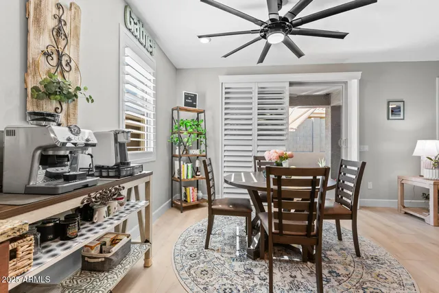 a view of a dining room with furniture and window