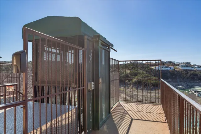 a aerial view of a house roof deck with table and chairs