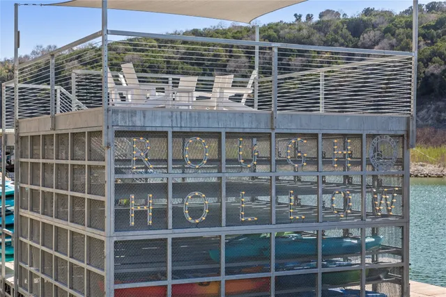 a view of swimming pool with outdoor seating and yard in back