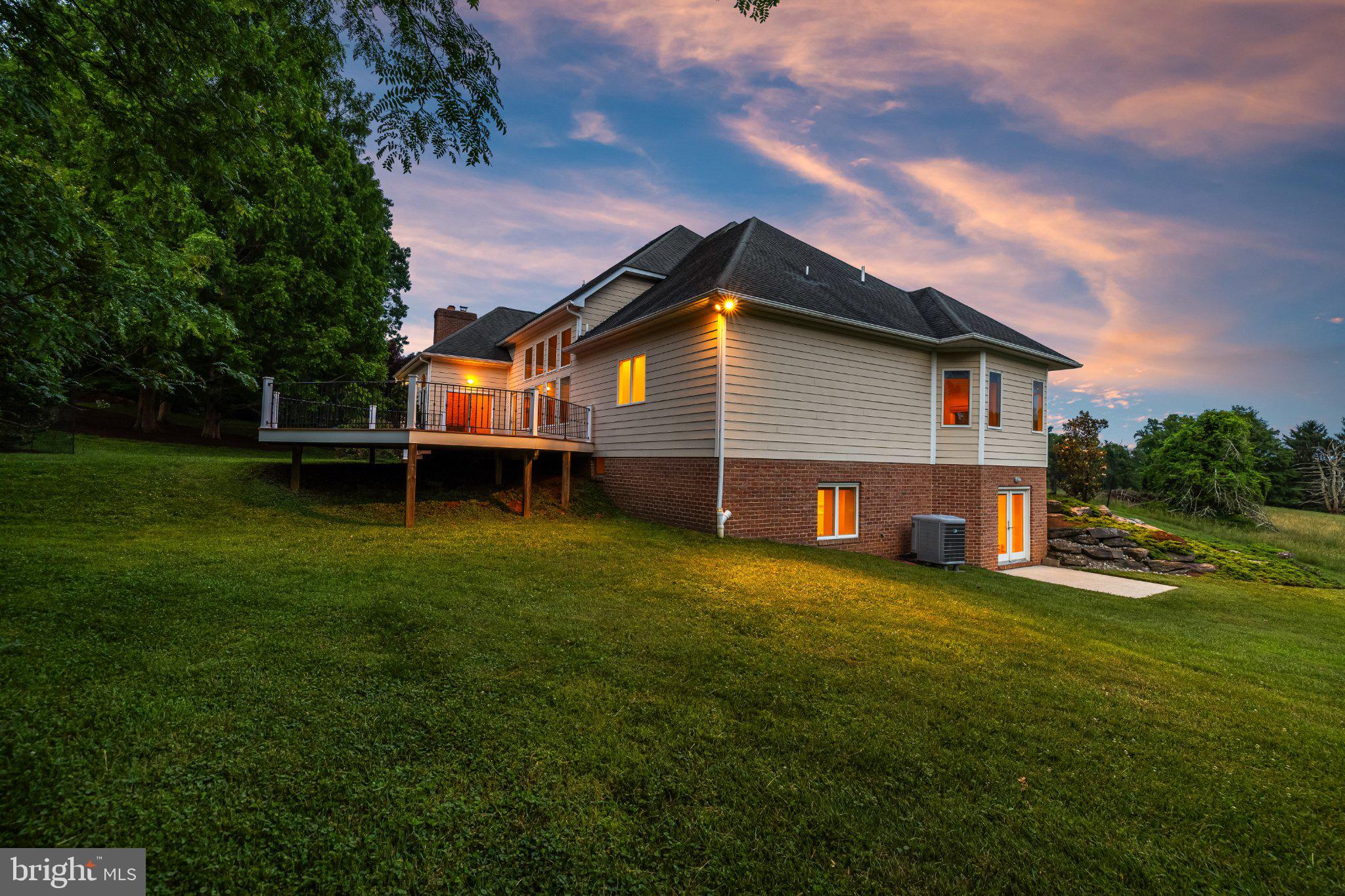 1310 Musgrove Road Lutherville-Timonium, MD 21093 - Photo 88 of 93 Charming home at dusk, serene setting.