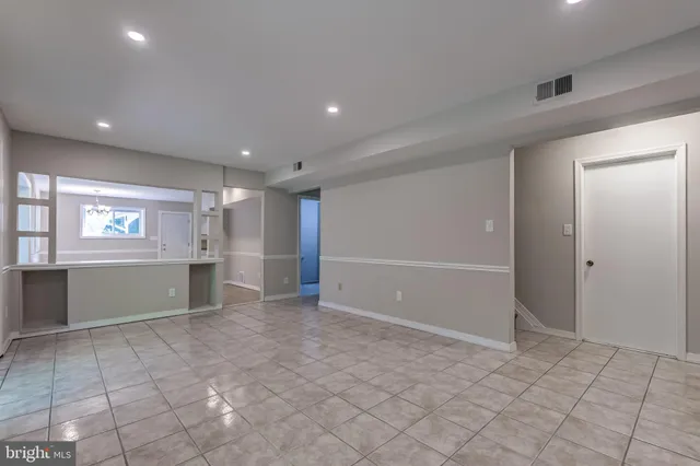 a view of a kitchen with a sink and a stove top oven