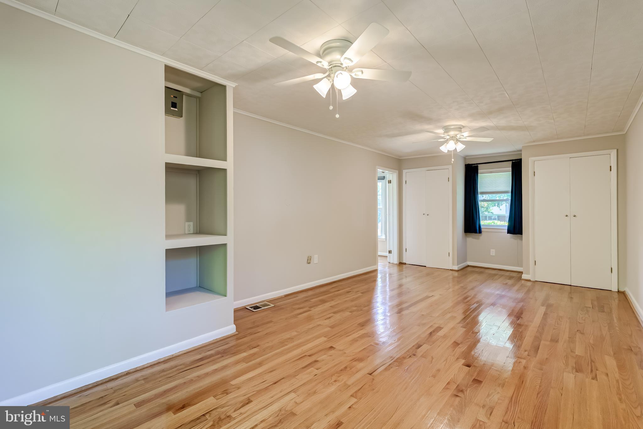 8817 Gateshead Road Alexandria, VA 22309 - Photo 31 of 78 wooden floor in an empty room with a window