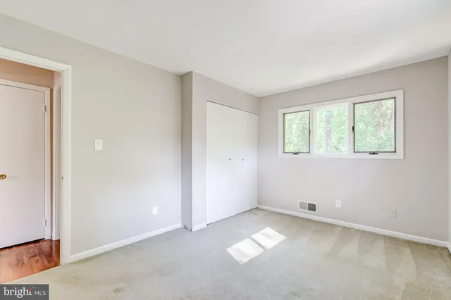 a view of hallway with wooden floor