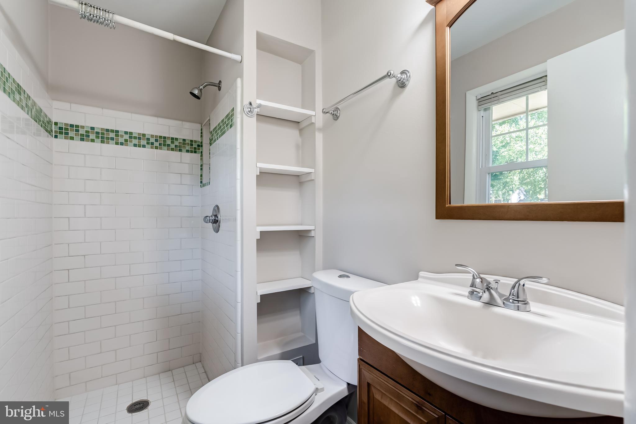 8817 Gateshead Road Alexandria, VA 22309 - Photo 59 of 78 a bathroom with a sink toilet and shower