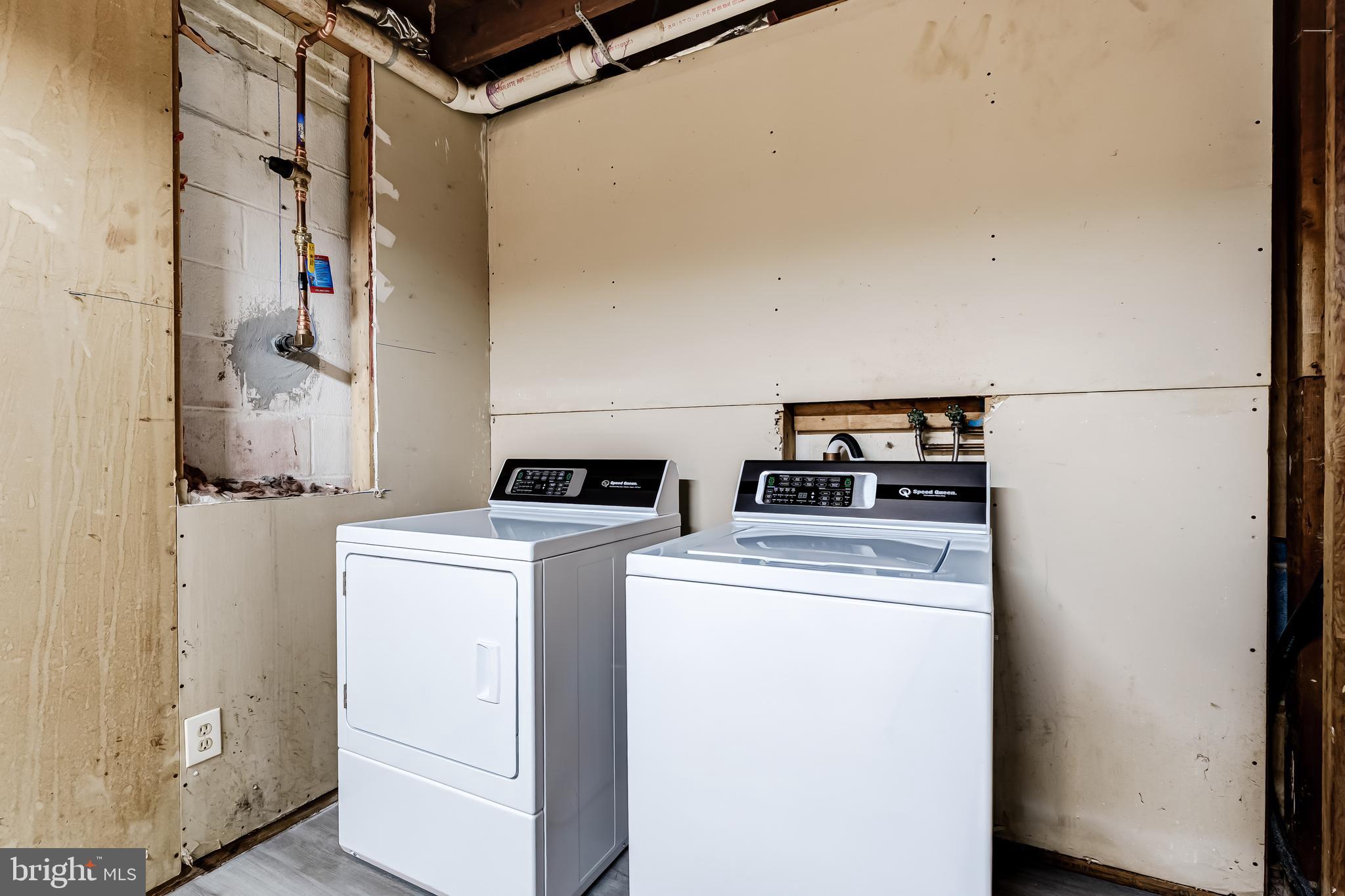 8817 Gateshead Road Alexandria, VA 22309 - Photo 60 of 78 a utility room with dryer and washer
