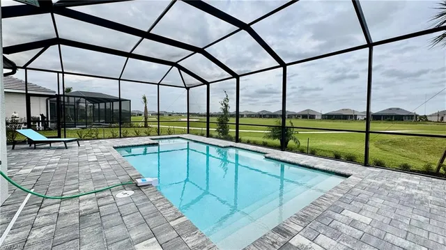 a view of a swimming pool with a porch