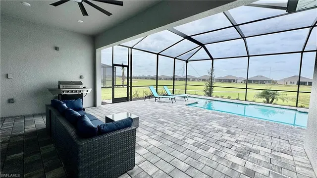 a view of living room with furniture and floor to ceiling window