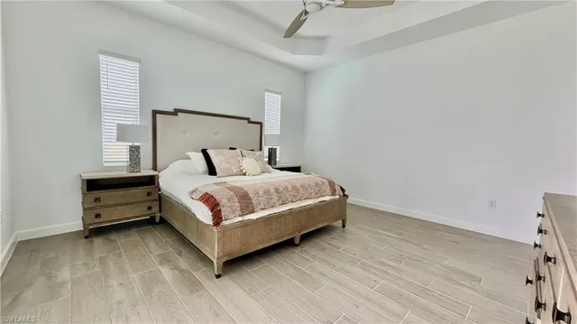 a bedroom with a bed and a night stand