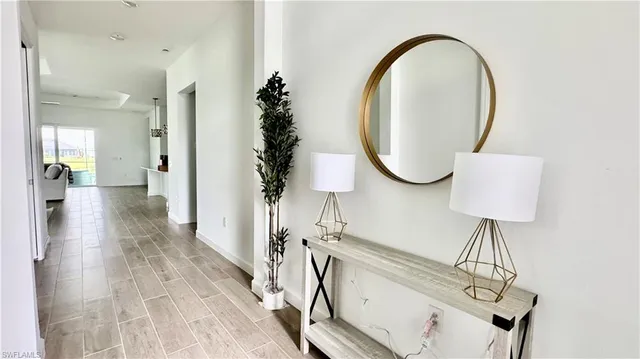 a view of a bathroom with a sink and mirror