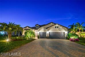 17574 Ashcomb Way Estero, FL 33928 - Photo 1 of 29 a front view of a house with a yard