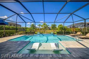 17574 Ashcomb Way Estero, FL 33928 - Photo 16 of 29 a view of a backyard with sitting area