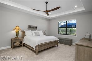 17574 Ashcomb Way Estero, FL 33928 - Photo 19 of 29 a bed sitting in a room next to a window