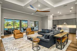 17574 Ashcomb Way Estero, FL 33928 - Photo 2 of 29 a living room with furniture and a large window