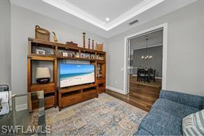 17574 Ashcomb Way Estero, FL 33928 - Photo 27 of 29 a living room with furniture a flat screen tv and a rug