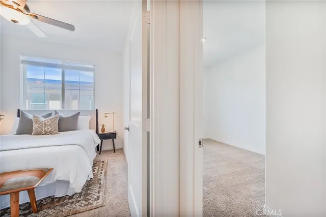 a bedroom with a bed and a mirror