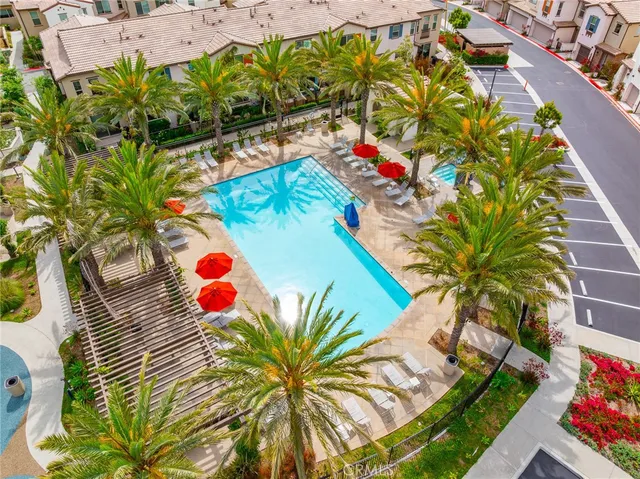 a view of swimming pool with sitting area