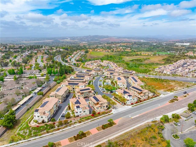 an aerial view of a house with yard swimming pool and outdoor seating