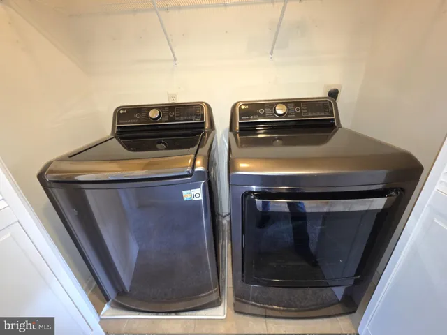 a utility room with washer and dryer