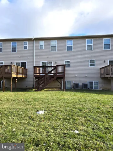 a backyard of a house with barbeque oven