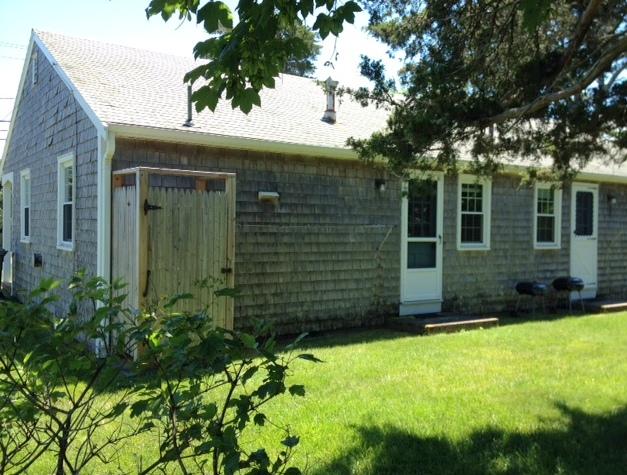 170 Beach Road Orleans, MA 02653 - Photo 2 of 10 front view of a house with a yard