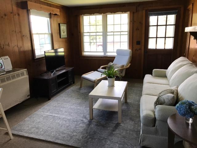 170 Beach Road Orleans, MA 02653 - Photo 3 of 10 a living room with furniture fireplace and windows