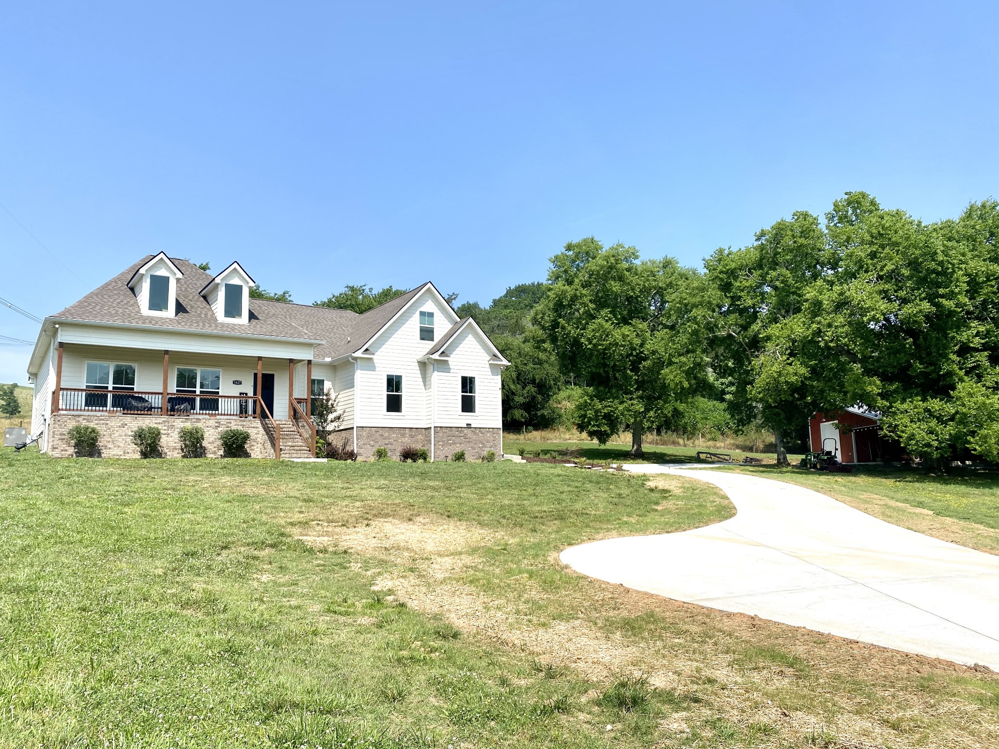 1427 Cliff Amos Road Spring Hill, TN 37174 - Photo 1 of 52 a front view of a house with a yard