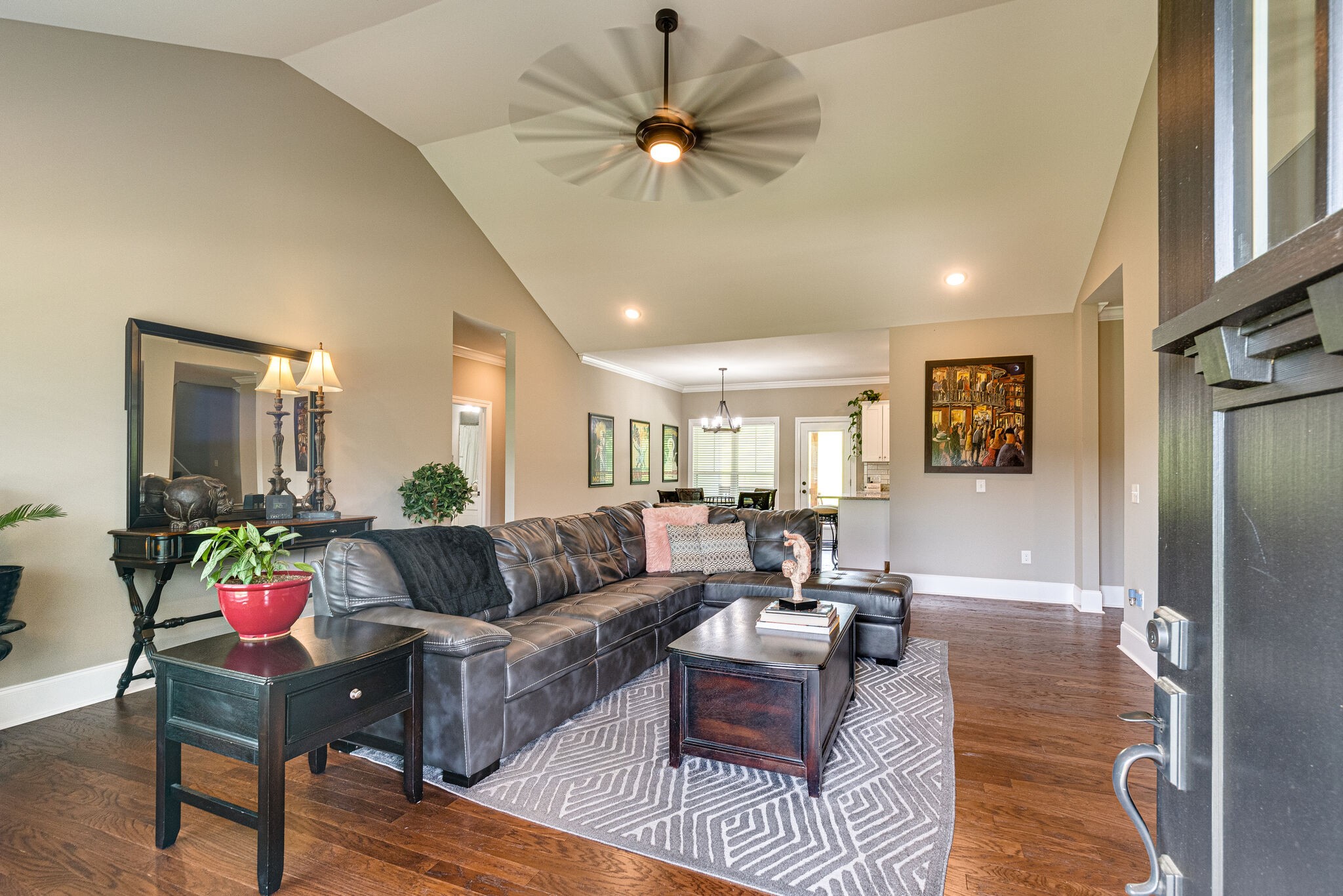 1427 Cliff Amos Road Spring Hill, TN 37174 - Photo 13 of 52 a living room with furniture and a chandelier