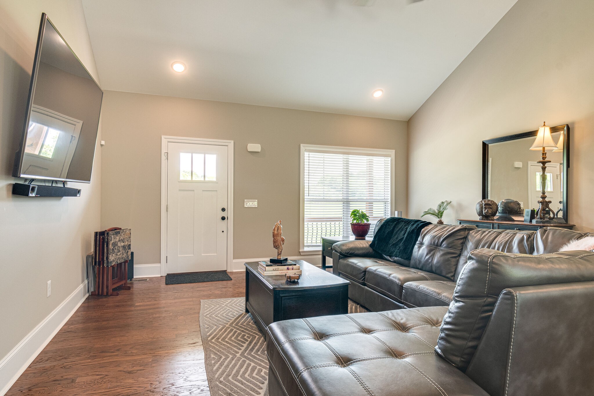 1427 Cliff Amos Road Spring Hill, TN 37174 - Photo 15 of 52 a living room with furniture and a flat screen tv