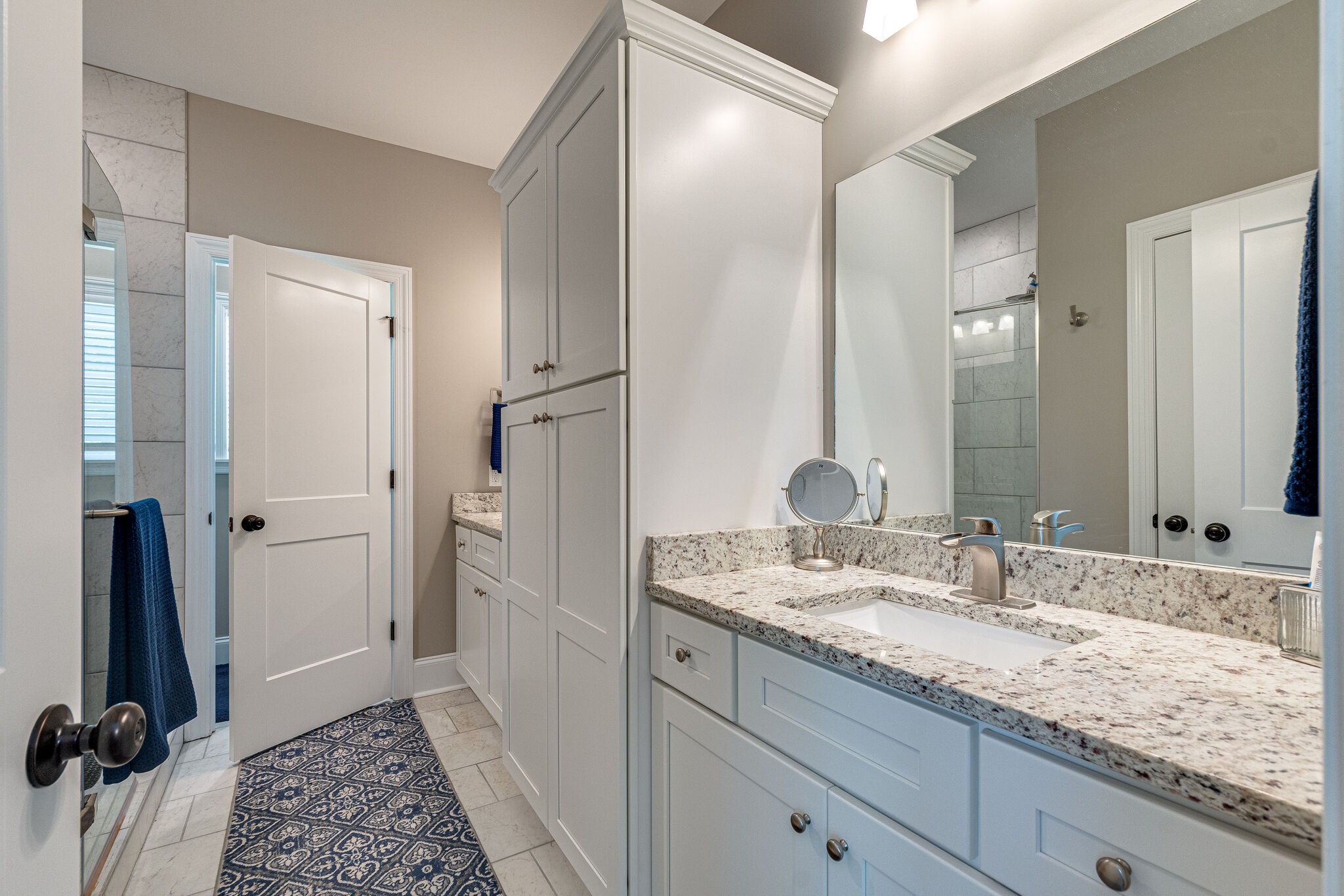 1427 Cliff Amos Road Spring Hill, TN 37174 - Photo 26 of 52 a bathroom with a granite countertop sink and a mirror