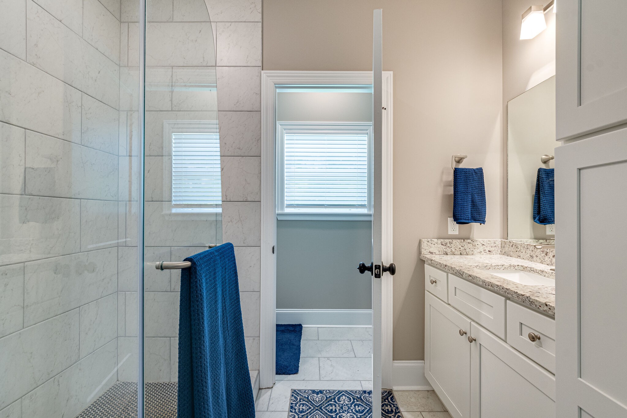 1427 Cliff Amos Road Spring Hill, TN 37174 - Photo 27 of 52 a bathroom with a sink and mirror with toilet