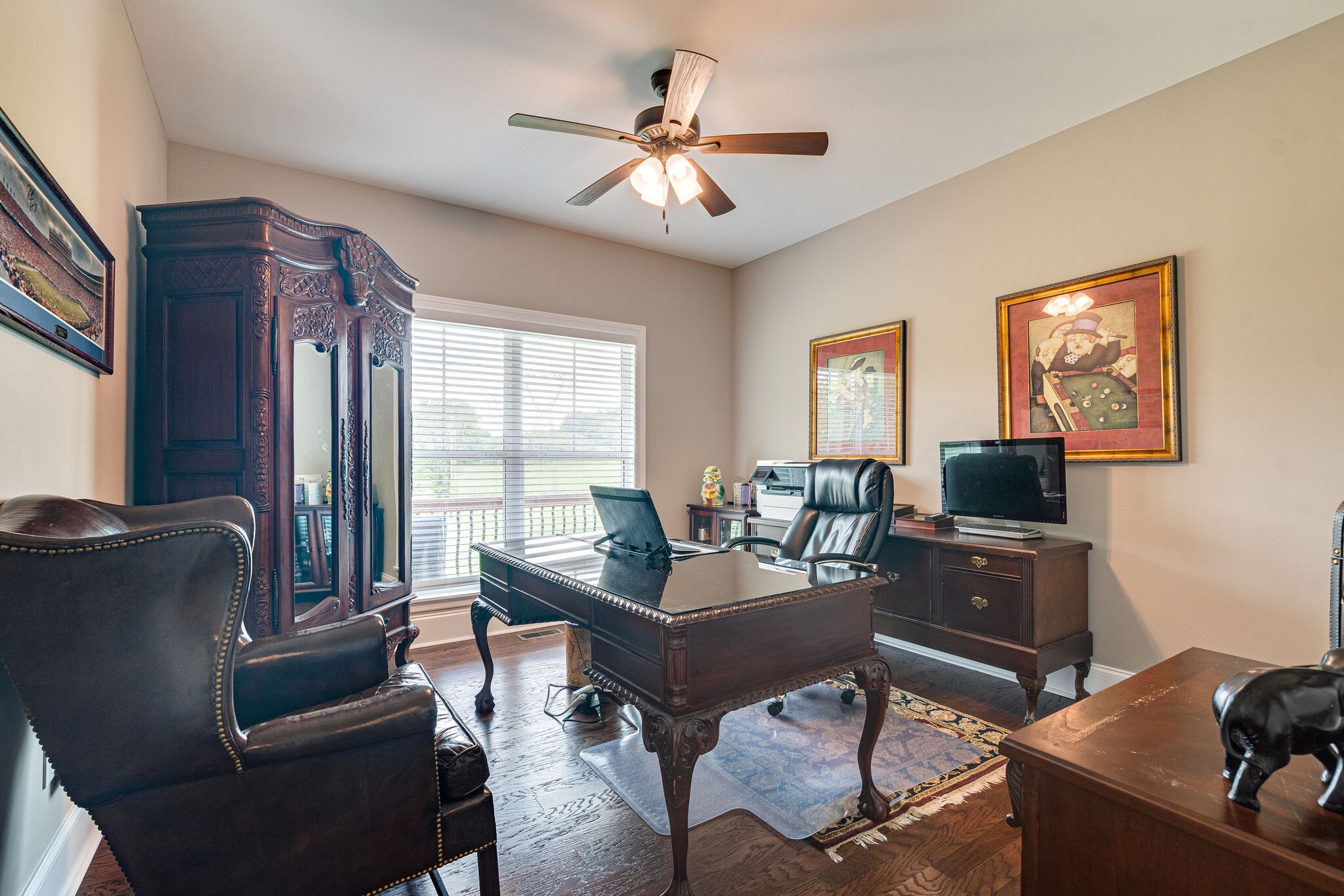 1427 Cliff Amos Road Spring Hill, TN 37174 - Photo 29 of 52 a living room with furniture a flat screen tv and a window