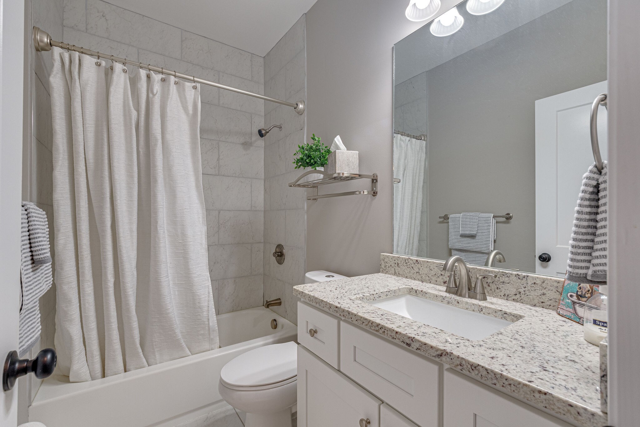 1427 Cliff Amos Road Spring Hill, TN 37174 - Photo 30 of 52 a bathroom with a granite countertop sink and a mirror