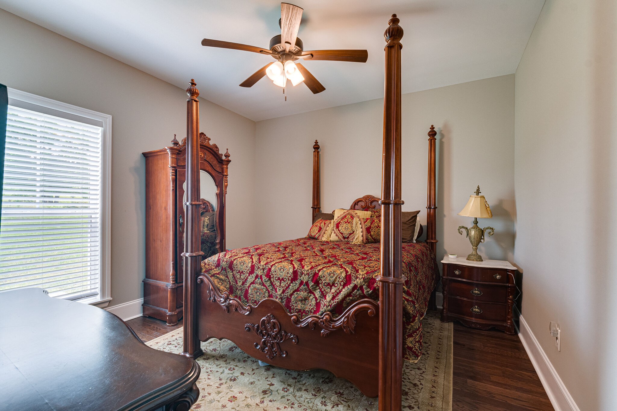 1427 Cliff Amos Road Spring Hill, TN 37174 - Photo 31 of 52 a bedroom with a bed and a chandelier