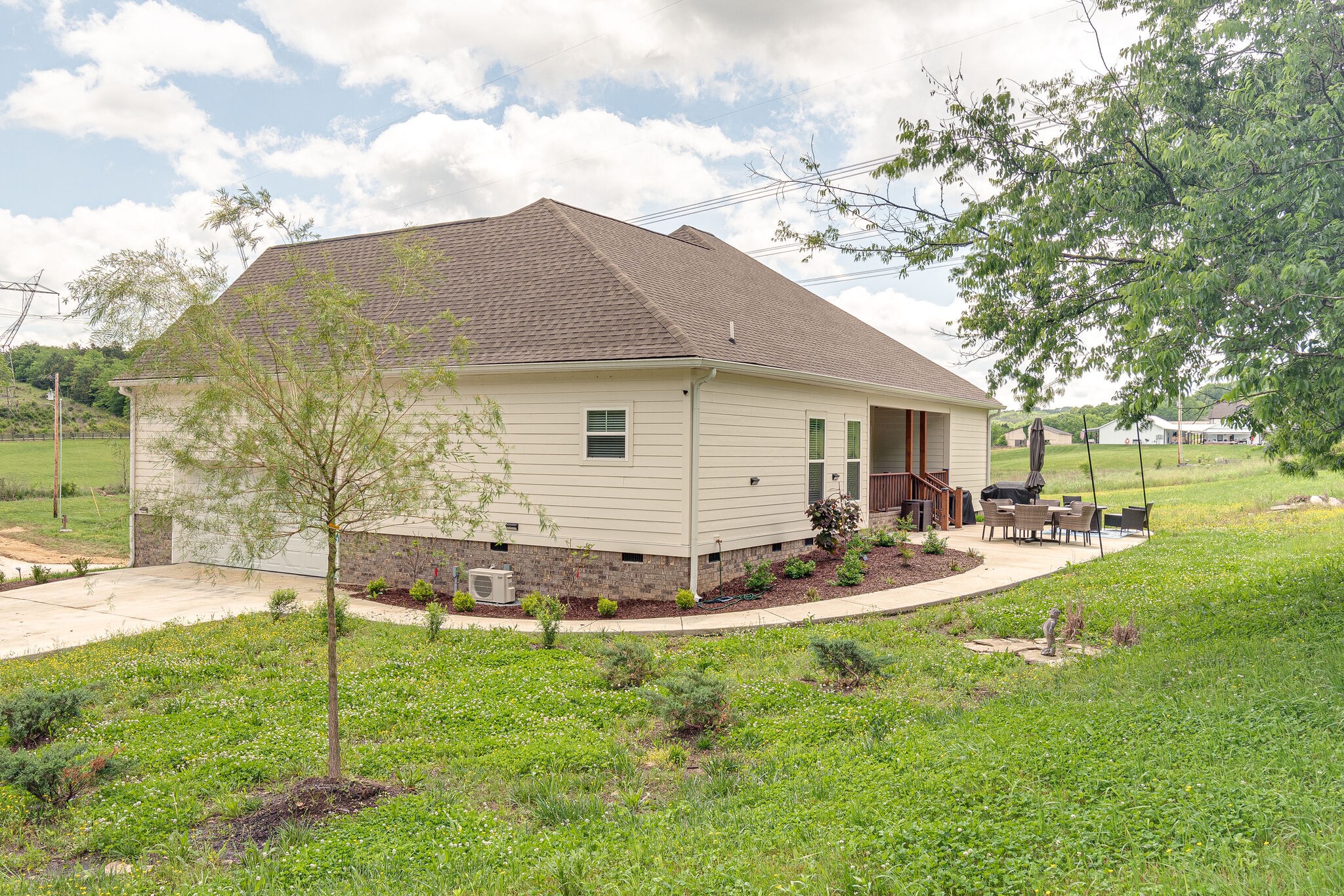 1427 Cliff Amos Road Spring Hill, TN 37174 - Photo 34 of 52 a view of a house with backyard and sitting area