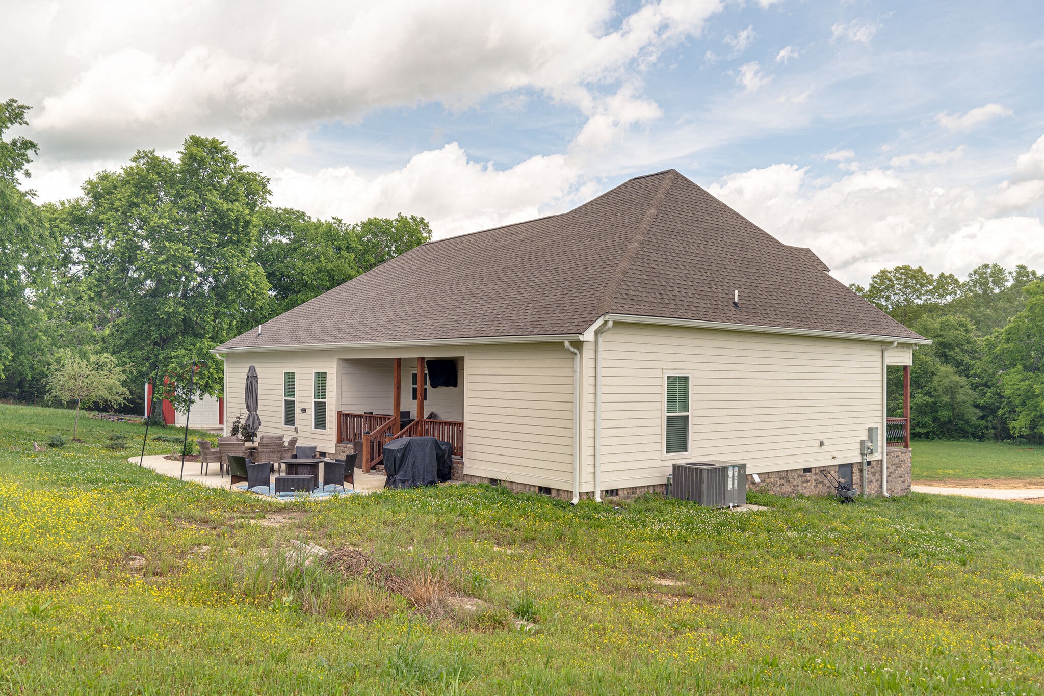 1427 Cliff Amos Road Spring Hill, TN 37174 - Photo 35 of 52 a backyard of a house with yard table and chairs