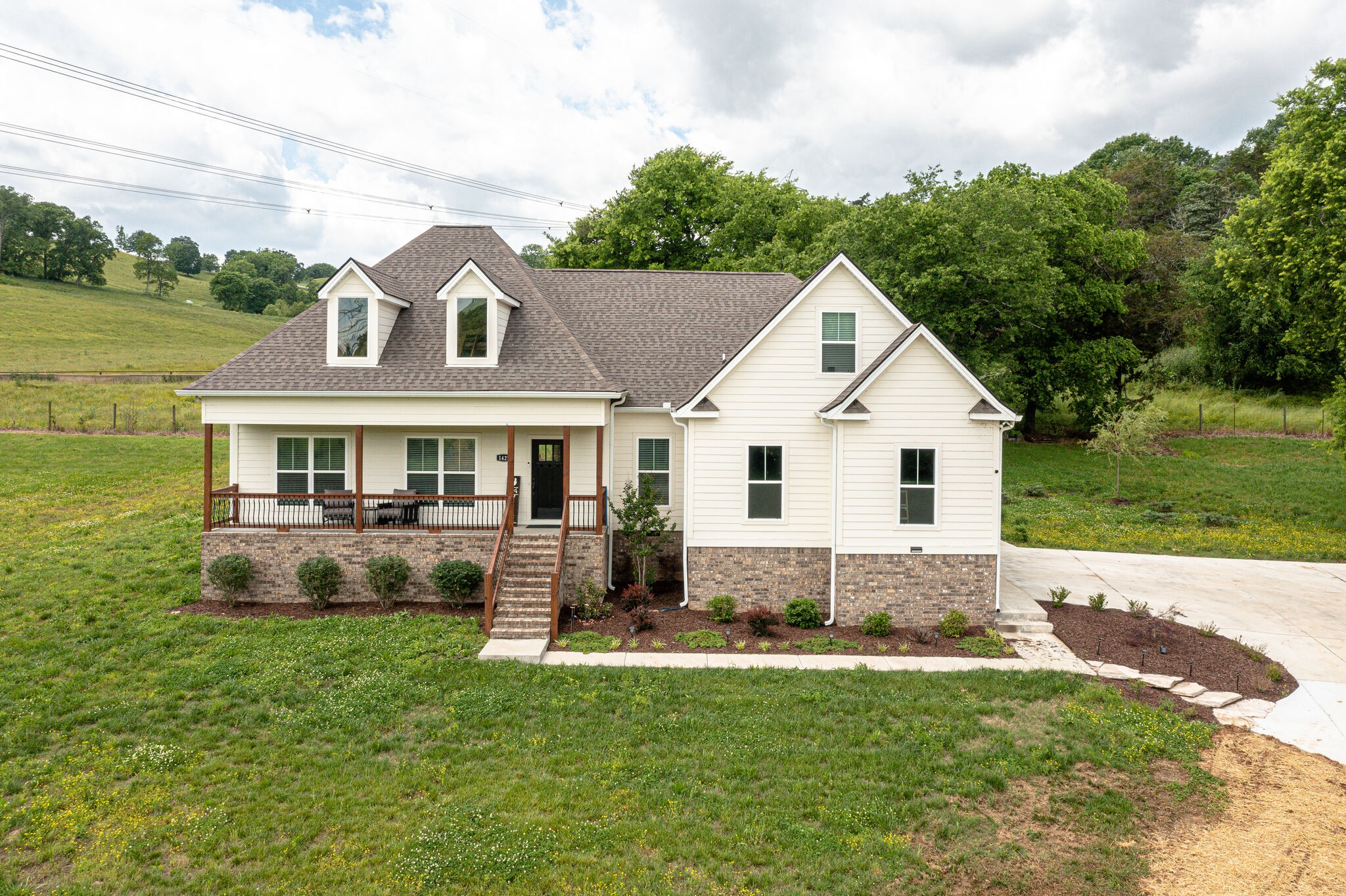 1427 Cliff Amos Road Spring Hill, TN 37174 - Photo 4 of 52 a front view of a house with a yard