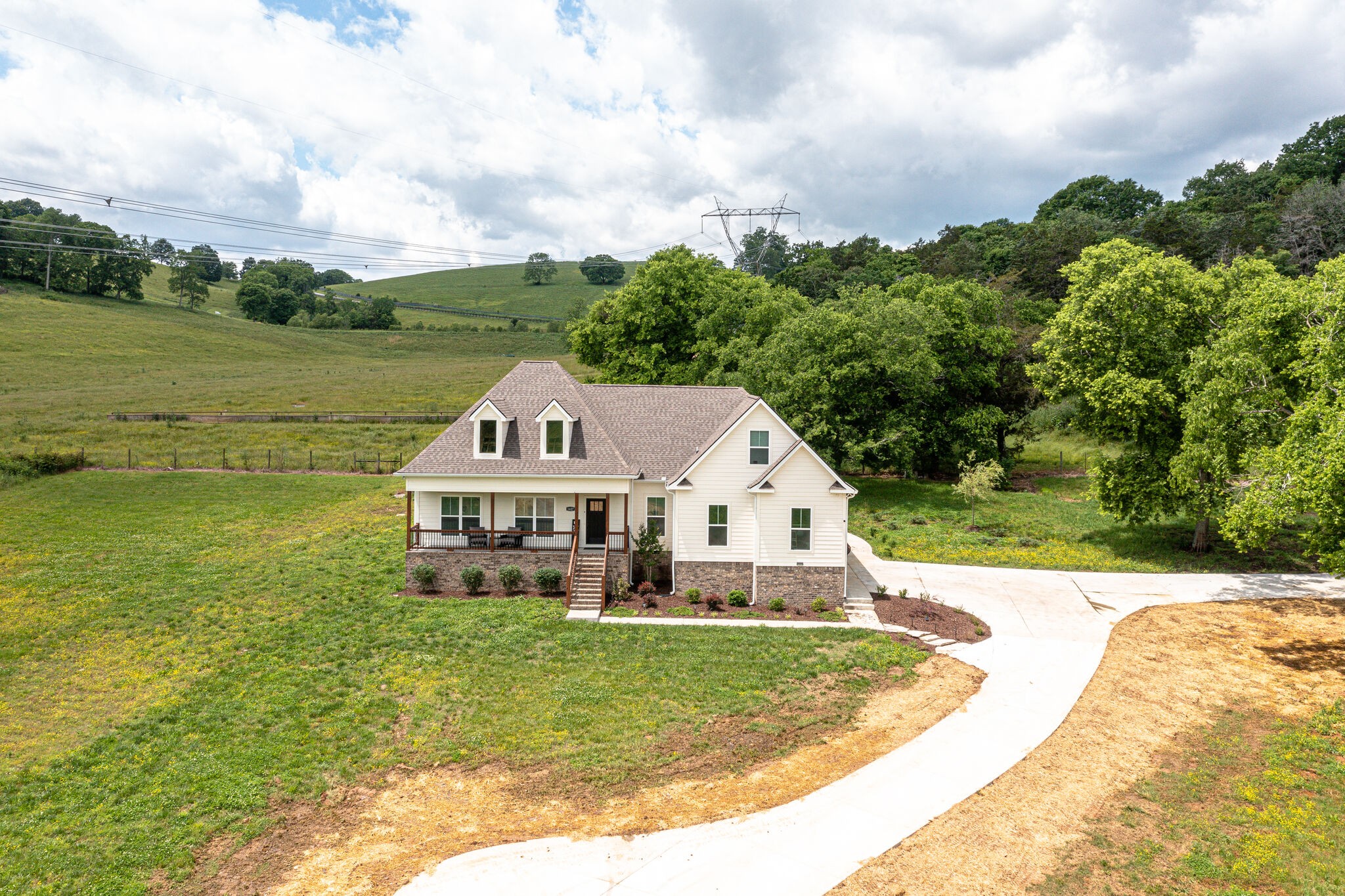 1427 Cliff Amos Road Spring Hill, TN 37174 - Photo 47 of 52 a view of a house with a big yard and large trees