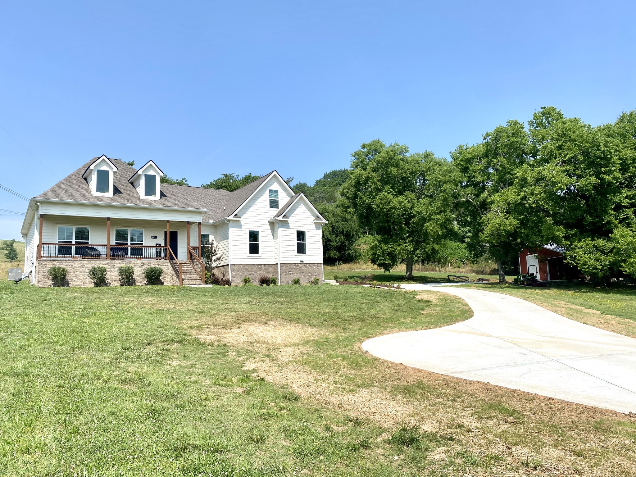 1427 Cliff Amos Road Spring Hill, TN 37174 - Photo 50 of 52 a front view of a house with a yard