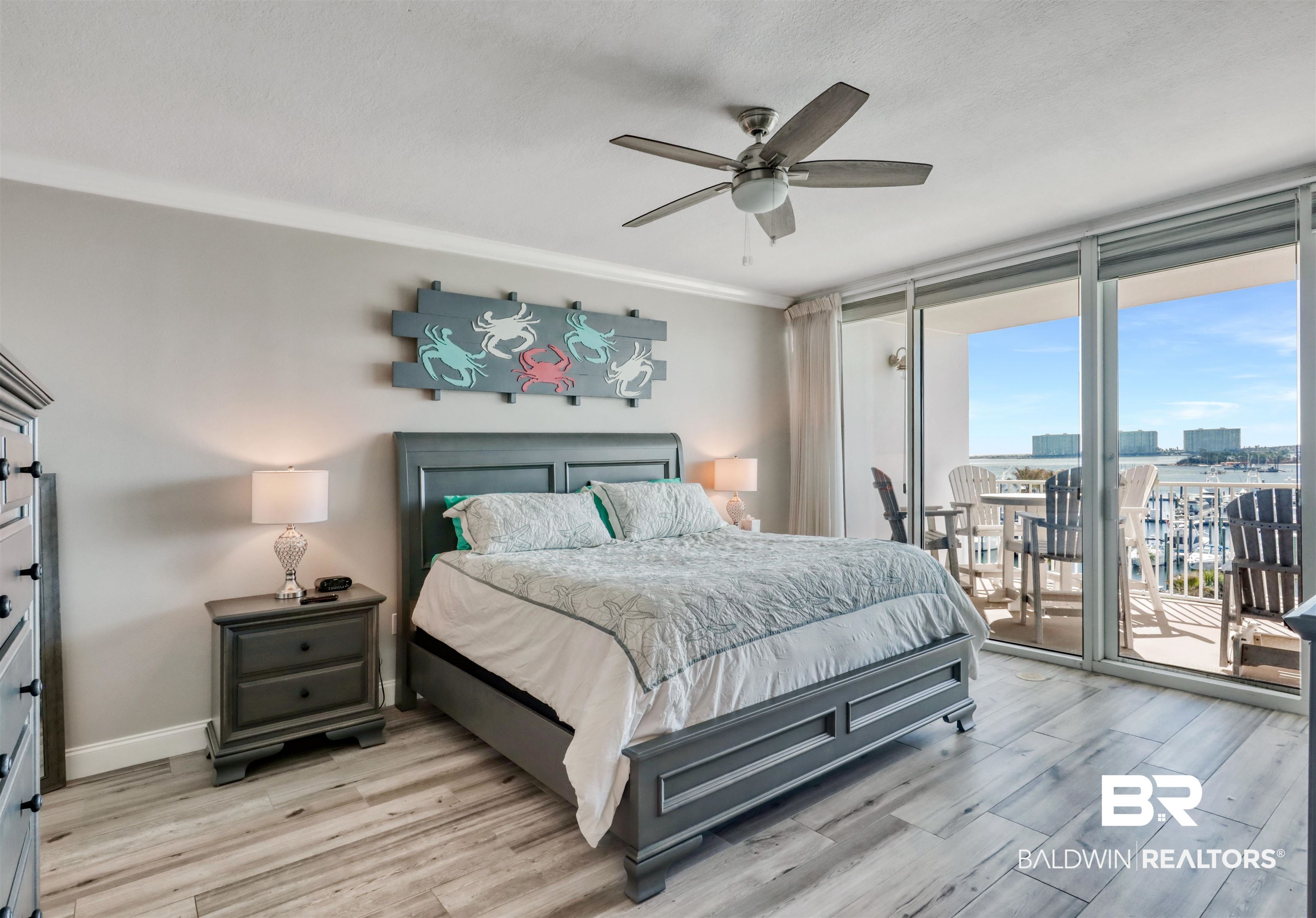 27800 Canal Road, Unit 403 & 404 Orange Beach, AL 36561 - Photo 9 of 39 Bedroom featuring light wood-type flooring, a ceiling fan, ornamental molding, access to exterior, and expansive windows