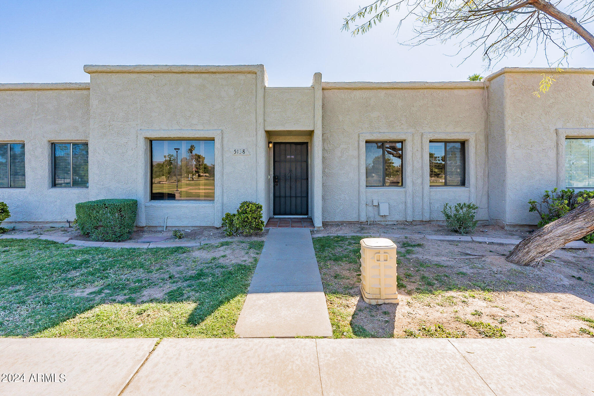 5138 North 81st Street Scottsdale, AZ 85250 - Photo 1 of 40 a front view of a house with garden