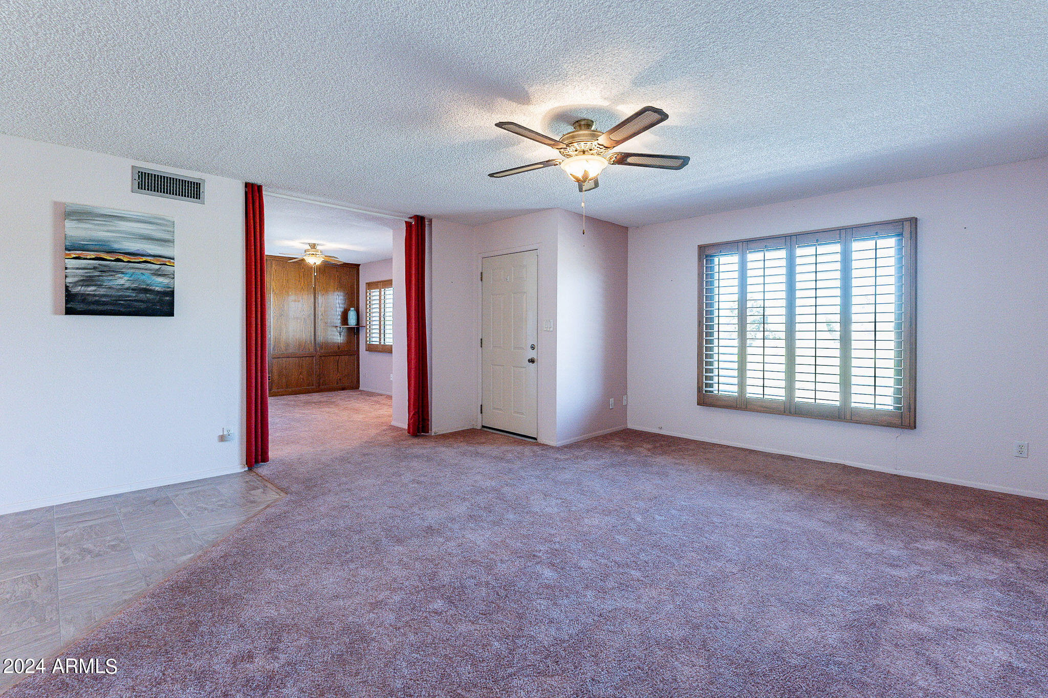 5138 North 81st Street Scottsdale, AZ 85250 - Photo 12 of 40 an empty room with windows and fan