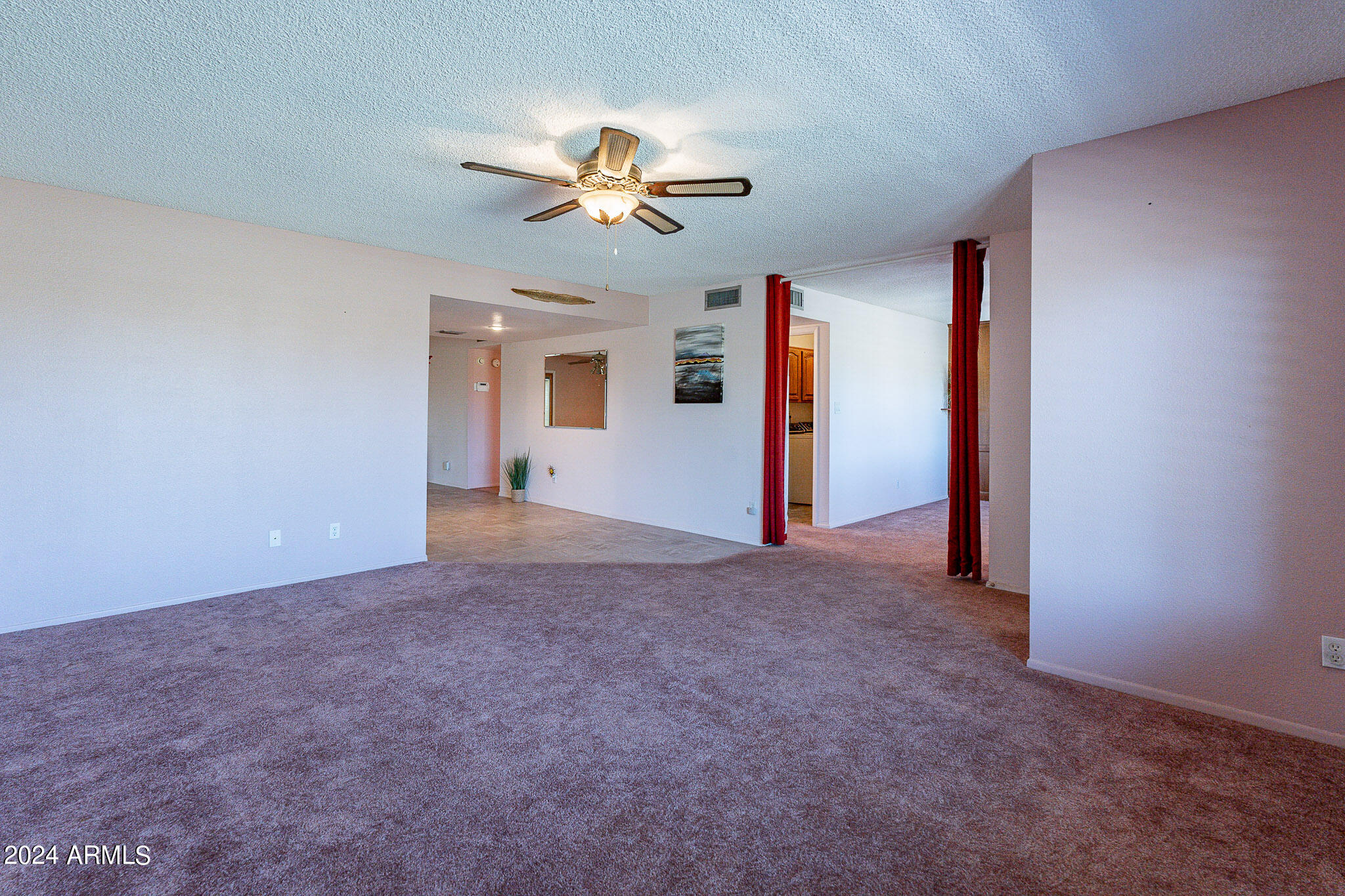 5138 North 81st Street Scottsdale, AZ 85250 - Photo 14 of 40 a view of a big room with closet and chandelier fan