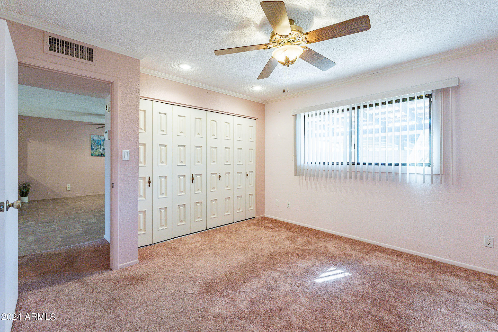 5138 North 81st Street Scottsdale, AZ 85250 - Photo 24 of 40 an empty room with chandelier fan