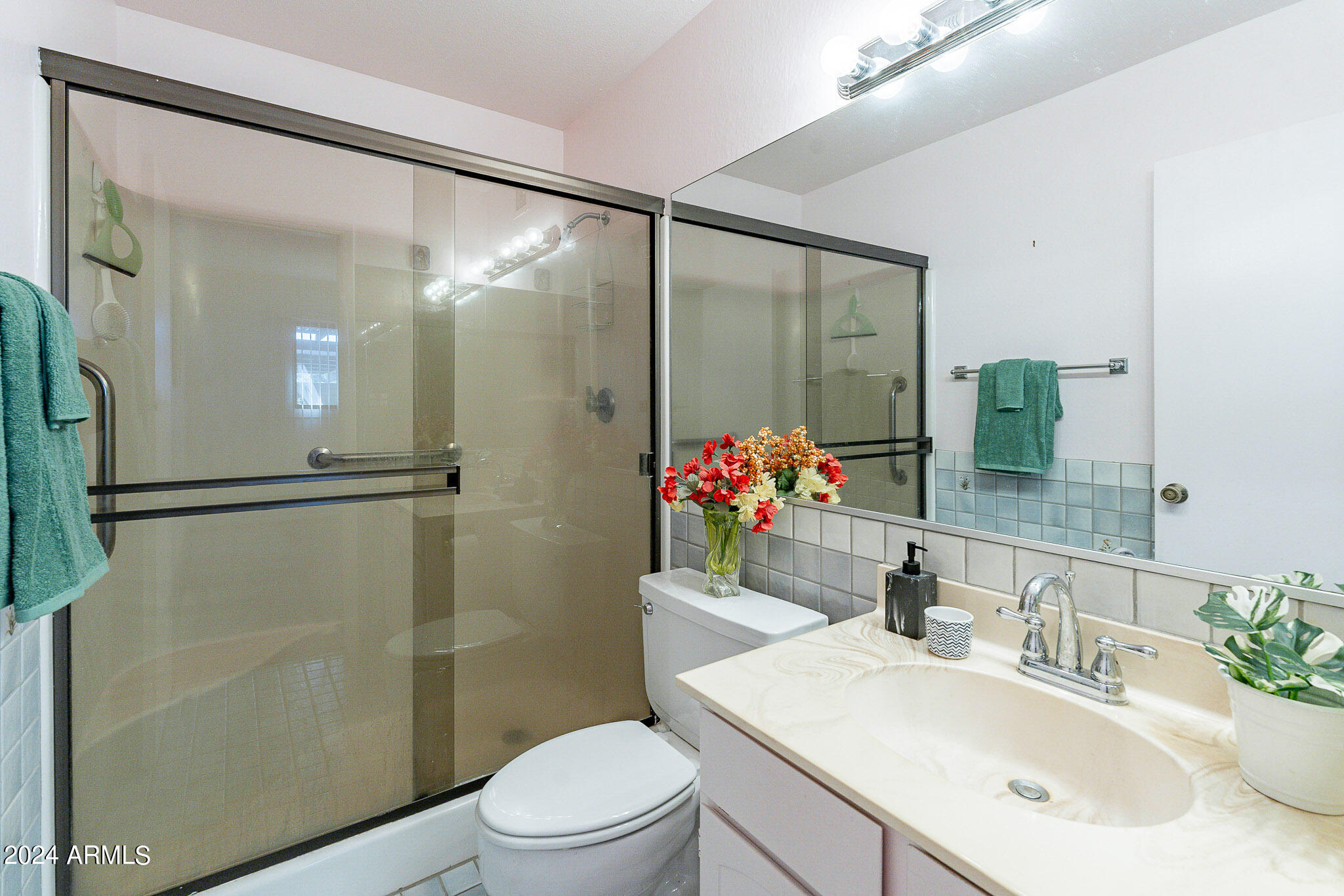 5138 North 81st Street Scottsdale, AZ 85250 - Photo 25 of 40 a bathroom with a sink toilet and shower