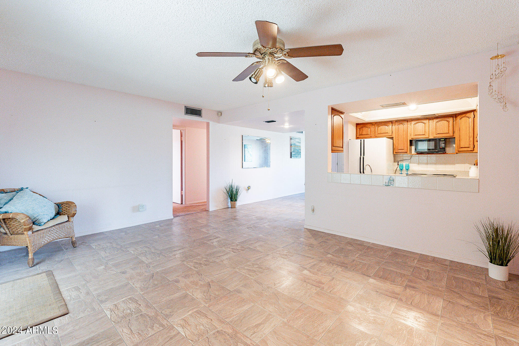 5138 North 81st Street Scottsdale, AZ 85250 - Photo 10 of 40 a view of livingroom with hardwood floor and a ceiling fan