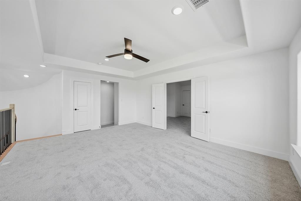 587 Mayfair Lane Frisco, TX 75033 - Photo 22 of 36 Unfurnished bedroom featuring a raised ceiling, recessed lighting, light colored carpet, and a ceiling fan