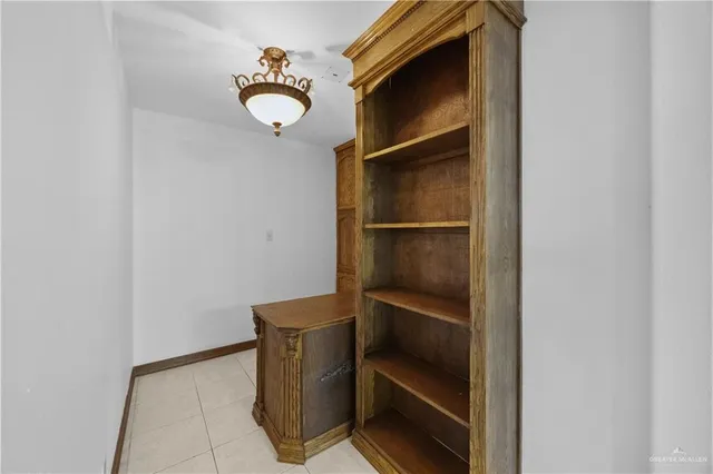 a kitchen with stainless steel appliances granite countertop a sink refrigerator and cabinets